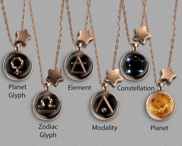 A range of Libra zodiac designs set in bronze coloured pendants