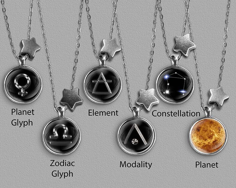 A range of Libra zodiac designs set in silver coloured pendants