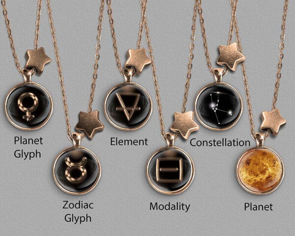 A range of Taurus zodiac designs set in bronze coloured pendants